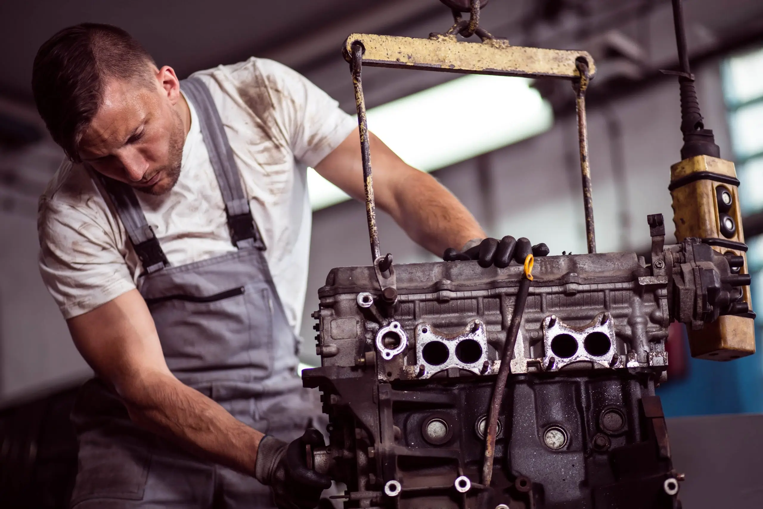 Mechanic working on a modern car engine