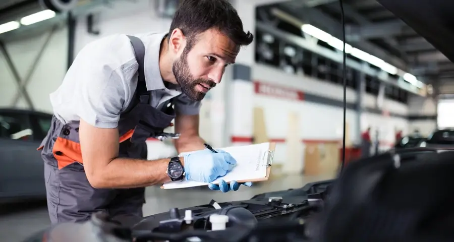 Mechanic explaining work to a customer