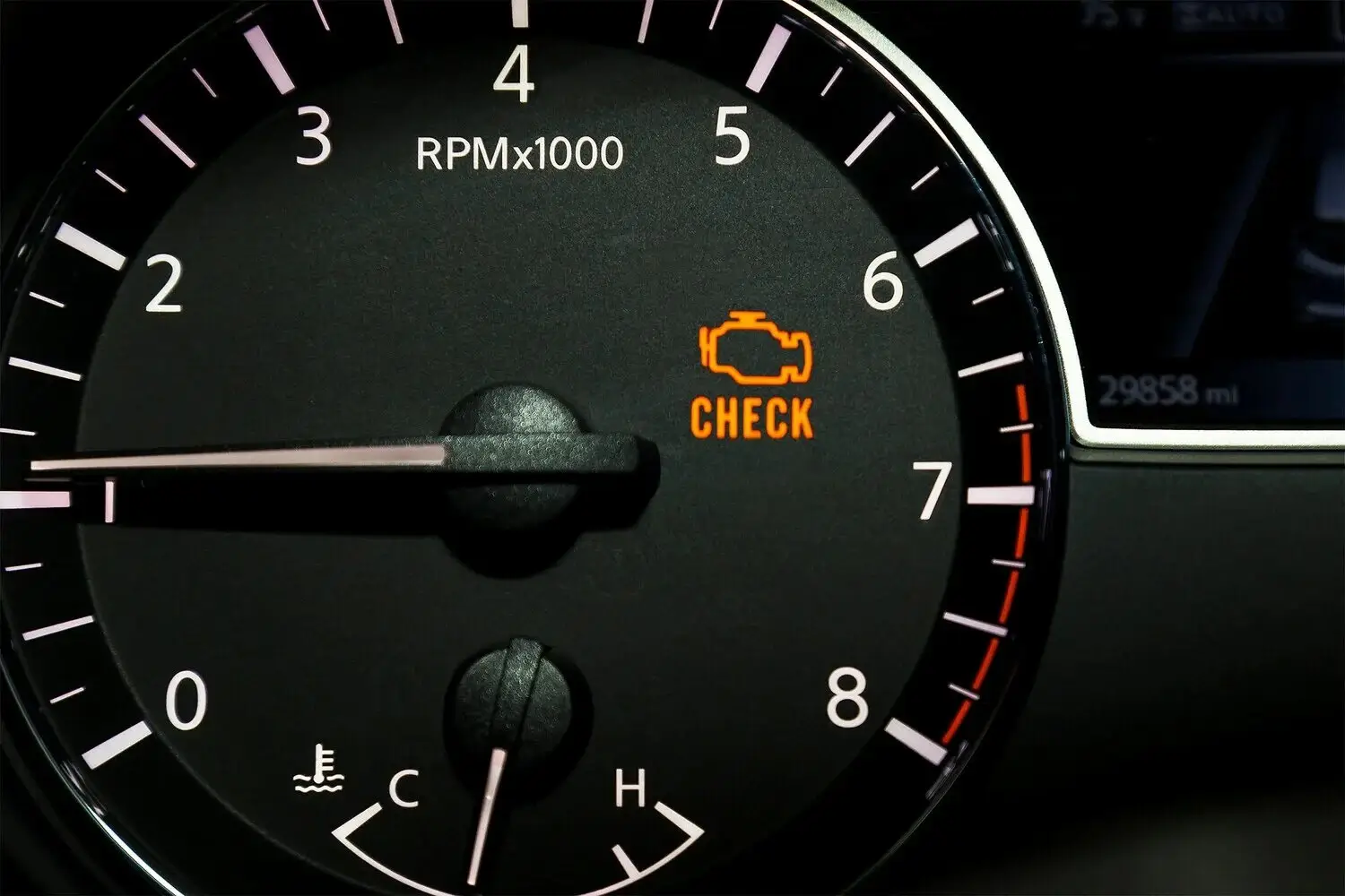 Check engine light on a dashboard
