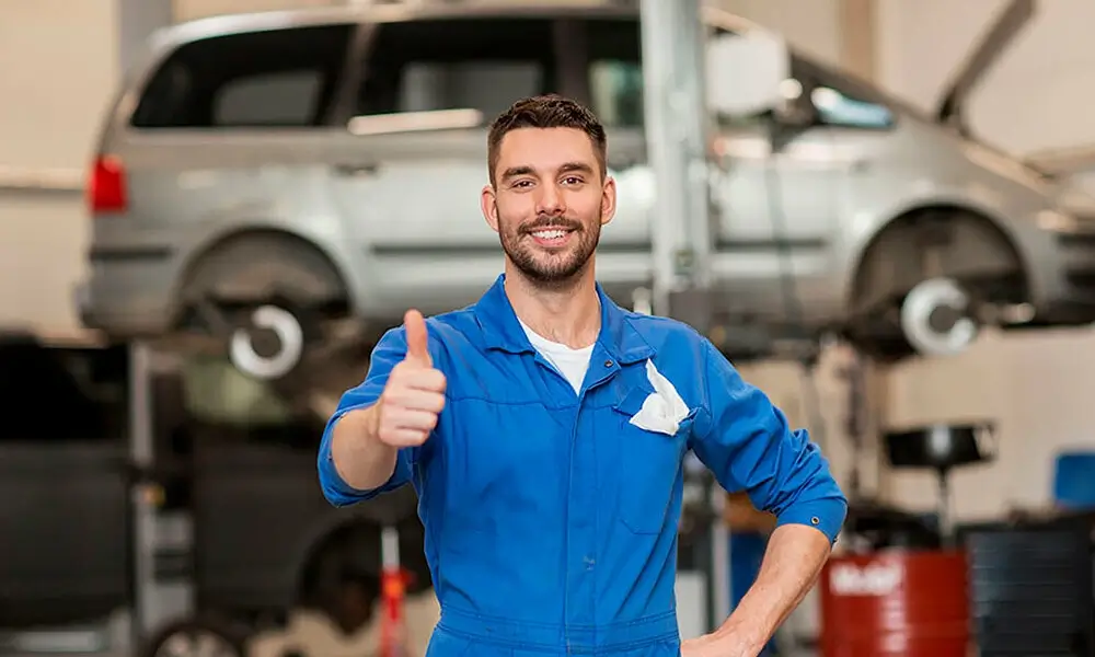 A team of professional mechanics collaborating in a workshop